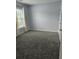 Bedroom with plush carpeting, neutral paint, and a large window at 103 Dupont Way, Summerville, SC 29485