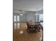 View of the dining area and kitchen with hardwood floors and open layout at 103 Dupont Way, Summerville, SC 29485