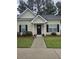 Charming single-story home with a manicured lawn and inviting front porch at 103 Dupont Way, Summerville, SC 29485