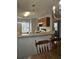 View of the kitchen from the dining area featuring wooden cabinetry, and white appliances at 103 Dupont Way, Summerville, SC 29485