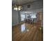 Open-concept living and dining area featuring hardwood floors and natural light at 103 Dupont Way, Summerville, SC 29485