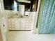 Bathroom featuring a vanity with a sink and a shower with a patterned curtain at 104 Silverhill Rd, Walterboro, SC 29488