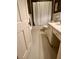 Neutral-toned bathroom featuring a toilet, vanity with countertop, and shower with curtain at 104 Silverhill Rd, Walterboro, SC 29488