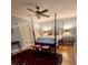 Bedroom with hardwood floors and a four-poster bed frame at 104 Silverhill Rd, Walterboro, SC 29488