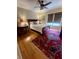 Comfortable bedroom features a wood sleigh bed, hardwood floors, and window blinds at 104 Silverhill Rd, Walterboro, SC 29488