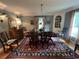 Formal dining room with traditional furniture, area rug, and natural light at 104 Silverhill Rd, Walterboro, SC 29488