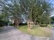 Traditional brick house with a well-maintained lawn and mature crape myrtle trees at 104 Silverhill Rd, Walterboro, SC 29488
