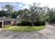 Beautiful brick home with mature landscaping and a circular driveway, offering a blend of classic style and practicality at 104 Silverhill Rd, Walterboro, SC 29488