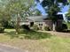 Traditional brick home set on a lush lot with mature trees, complemented by a well-kept lawn and landscaping at 104 Silverhill Rd, Walterboro, SC 29488