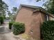 Brick exterior detailing with mature shrubs and a well-kept lawn at 104 Silverhill Rd, Walterboro, SC 29488