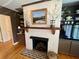 Close-up of living room fireplace with mantle and built-in shelving at 104 Silverhill Rd, Walterboro, SC 29488