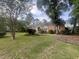 Traditional brick home featuring a well-maintained lawn and mature trees at 104 Silverhill Rd, Walterboro, SC 29488