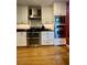 Updated kitchen with stainless steel appliances and white cabinets with black countertops at 104 Silverhill Rd, Walterboro, SC 29488