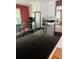 Kitchen with granite countertop, stainless steel refrigerator, and wood floors at 104 Silverhill Rd, Walterboro, SC 29488