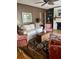 Spacious living room with white sofa, area rug, and decorative fireplace at 104 Silverhill Rd, Walterboro, SC 29488