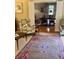 View of the living room leading into the dining room, with beautiful wood floors at 104 Silverhill Rd, Walterboro, SC 29488