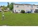 Spacious backyard with lush green grass and a seating area at 108 Spanish Oaks Ln, Ladson, SC 29456