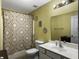 Bathroom with a white vanity, toilet and yellow walls with a floral shower curtain at 108 Spanish Oaks Ln, Ladson, SC 29456