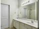 Bathroom features a white vanity with a large mirror and a shower with glass doors at 108 Spanish Oaks Ln, Ladson, SC 29456