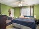 Bedroom featuring a large bed, crib, green walls, and a ceiling fan at 108 Spanish Oaks Ln, Ladson, SC 29456