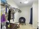 Organized walk-in closet with shelving, hanging space, and a cozy seating area at 108 Spanish Oaks Ln, Ladson, SC 29456