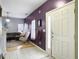 Inviting entryway with tiled floor leading into a living area with a gray couch and modern rocking chair at 108 Spanish Oaks Ln, Ladson, SC 29456