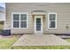 Backyard featuring a patio, a door leading inside and two symmetrical windows at 110 Instructor Ct, Ladson, SC 29456