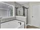 Modern bathroom with soaking tub, marble tile accent, and glass-enclosed shower at 110 Instructor Ct, Ladson, SC 29456