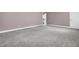 Spacious bonus room with gray carpet leading to the staircase at 110 Instructor Ct, Ladson, SC 29456