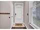 Welcoming front entrance featuring a white door, 'hello' mat, and window with blinds at 110 Instructor Ct, Ladson, SC 29456
