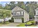Charming two-story home with a well-maintained yard, two-car garage, and tasteful landscaping at 110 Instructor Ct, Ladson, SC 29456
