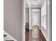 Elegant hallway featuring wood flooring leading to the front door and staircase at 110 Instructor Ct, Ladson, SC 29456