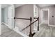 Upstairs hallway with modern flooring and railing, showcasing the home's design and flow at 110 Instructor Ct, Ladson, SC 29456