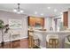 Kitchen featuring bar seating, hardwood floors, and granite countertops at 110 Instructor Ct, Ladson, SC 29456