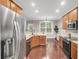 Modern kitchen with granite countertops, stainless steel appliances and hardwood floors at 110 Instructor Ct, Ladson, SC 29456