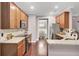 Modern kitchen with stainless steel appliances, hardwood floors, and granite countertops at 110 Instructor Ct, Ladson, SC 29456