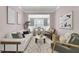 Stylish living room with modern decor, a comfortable sofa, and an adjacent dining area at 110 Instructor Ct, Ladson, SC 29456