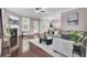 Spacious living room with hardwood floors, fireplace, TV, stylish furniture, and lots of natural light at 110 Instructor Ct, Ladson, SC 29456