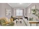 Inviting living room featuring a modern sofa, stylish decor, and plenty of natural light at 110 Instructor Ct, Ladson, SC 29456