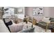 Well-decorated living room featuring a modern sofa and stylish decor leading to dining space at 110 Instructor Ct, Ladson, SC 29456
