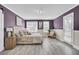 Stylish main bedroom featuring vinyl floors, ample natural light, and elegant decor at 110 Instructor Ct, Ladson, SC 29456