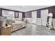 Well-lit main bedroom boasting neutral colors, multiple windows, and access to a private patio at 110 Instructor Ct, Ladson, SC 29456