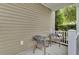 Cozy outdoor patio showcasing two gray chairs, perfect for enjoying quiet mornings or afternoons at 110 Instructor Ct, Ladson, SC 29456