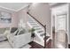 View of staircase with hardwood floors and white banister leading to the upper level at 110 Instructor Ct, Ladson, SC 29456