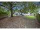 Lush backyard featuring mature trees and open space, providing a serene and private outdoor retreat at 116 Holbrook Ln, Goose Creek, SC 29445