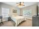 Comfortable bedroom with carpet, two windows providing natural light, and a ceiling fan at 116 Holbrook Ln, Goose Creek, SC 29445