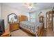 Large bedroom with wooden furnishings and decor, with dark carpet at 116 Holbrook Ln, Goose Creek, SC 29445