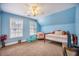 A cozy, blue-toned bedroom with twin beds, windows, and personal touches at 116 Holbrook Ln, Goose Creek, SC 29445