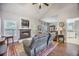Comfortable living room showcasing a fireplace, hardwood flooring, vaulted ceiling, and a neutral color palette at 116 Holbrook Ln, Goose Creek, SC 29445