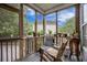 Relaxing screened porch with comfortable seating, potted plants, and a serene view of the surrounding landscape at 116 Holbrook Ln, Goose Creek, SC 29445